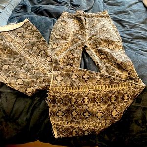 Free people snake skin denim bell bottoms.
